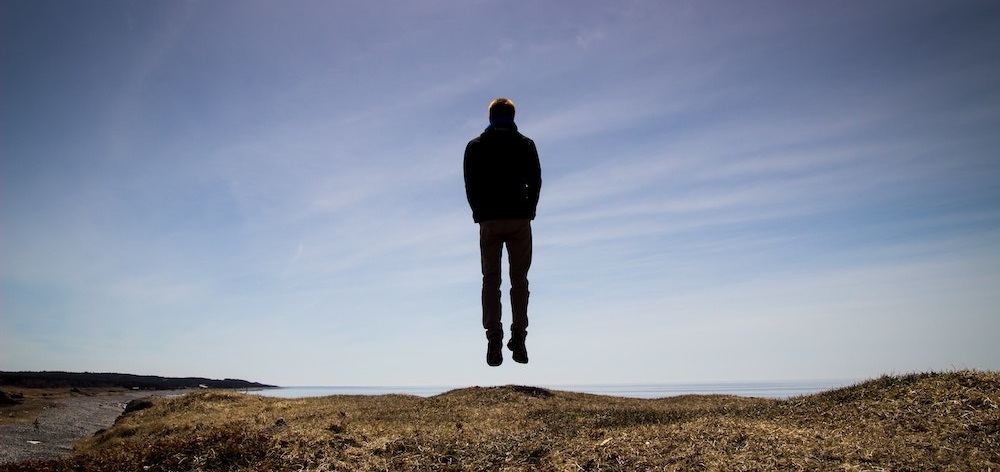 A person floating above the ground