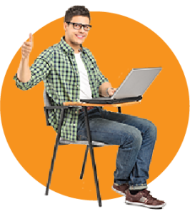 A man sitting at a desk with a laptop giving a thumbs up