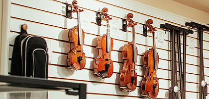 Violins hanging on a wall