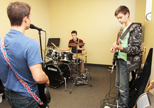 A group of students practicing music together