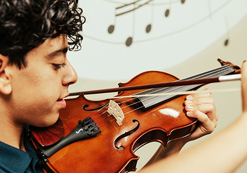 A boy playing violin