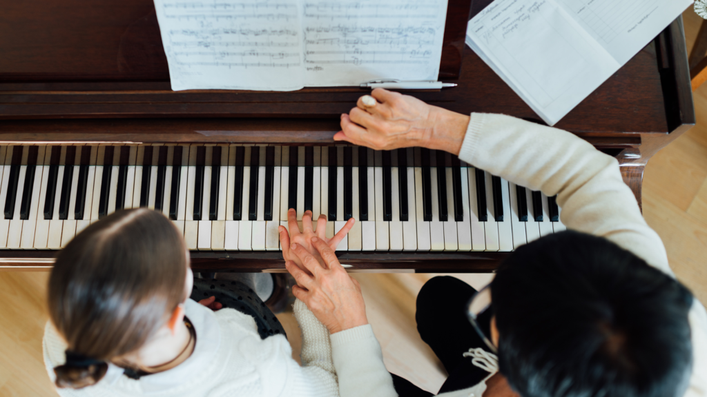 Child balancing homework and piano practice during a busy fall schedule