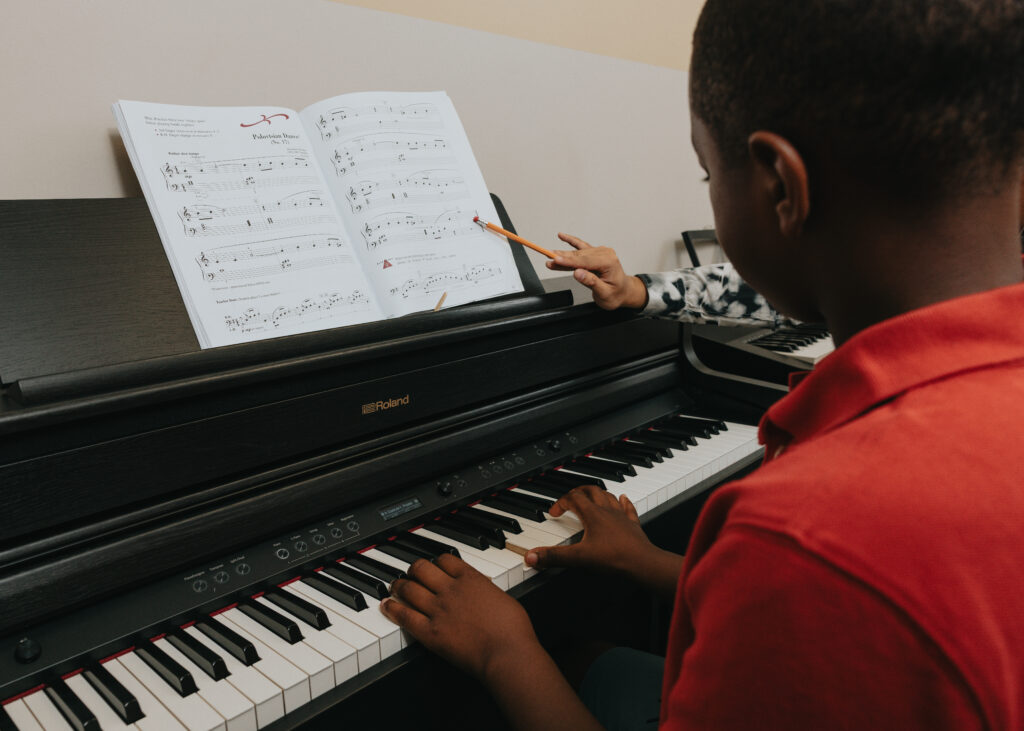 Child starting piano lessons mid-fall at The Piano Studio in Newmarket